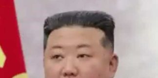 উত্তর কোরিয়ার আধিকারিকদের পোশাকে কিমের ছবি Picture of Kim dressed as a North Korean official