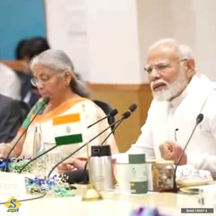 Prime Minister in a meeting with economists