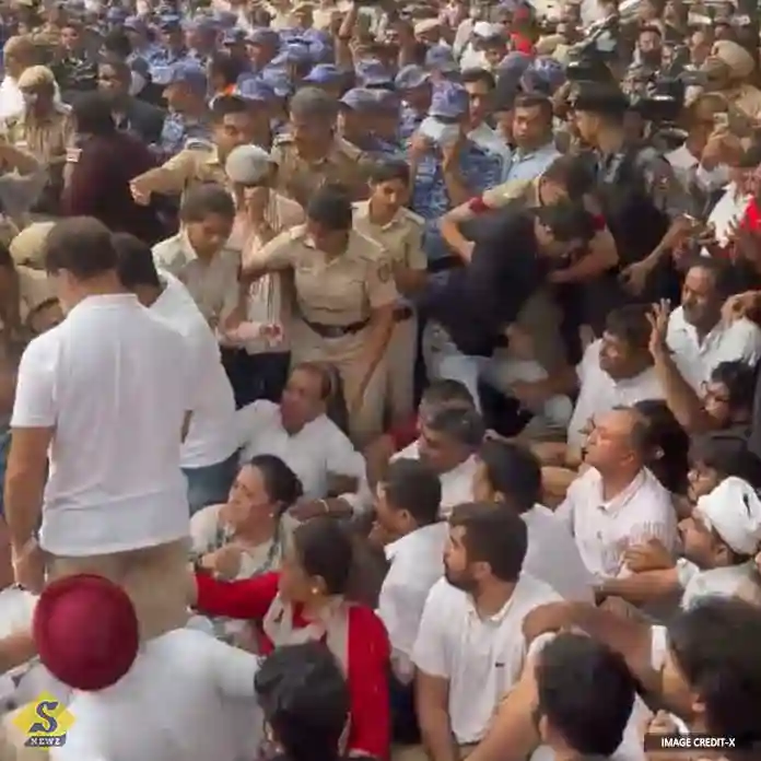Police-remove-Rahul-and-others-staging-a-sit-in-demanding-Modi's-resignation